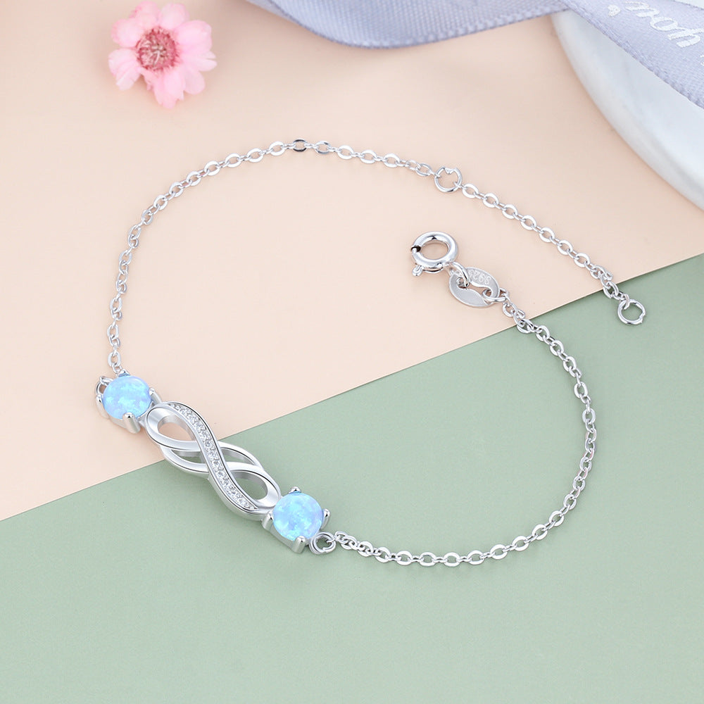 Twist Zircon Infinite Symbol with Double Blue Round Opal Sterling Silver Bracelet