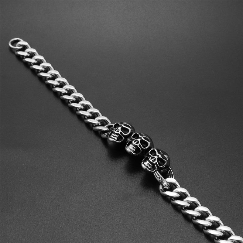 Men's Bold Titanium Steel Triple Skull Bracelet - Unique Rough Cast Accessory