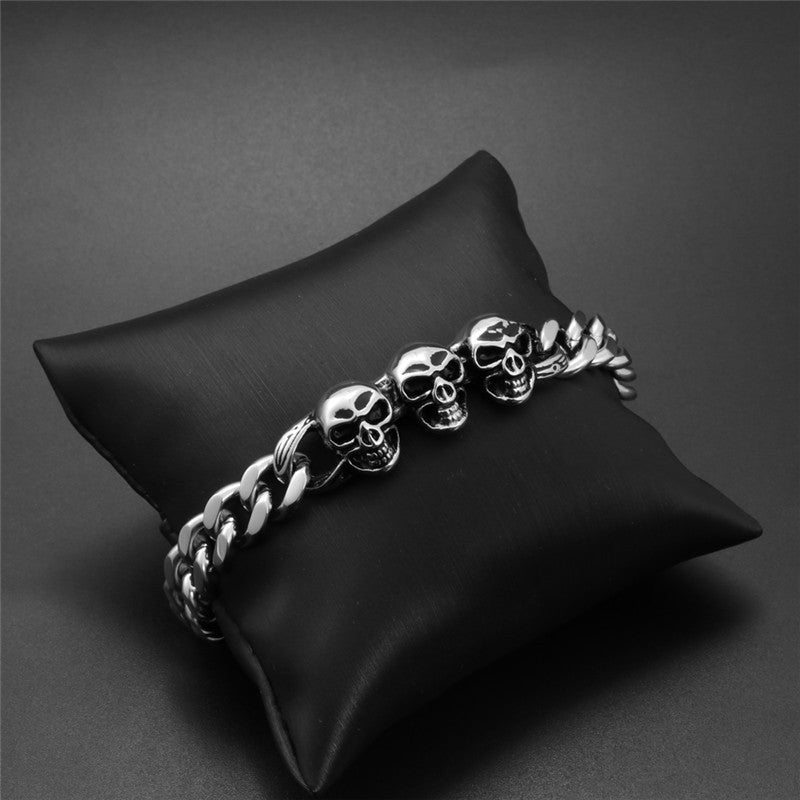 Men's Bold Titanium Steel Triple Skull Bracelet - Unique Rough Cast Accessory