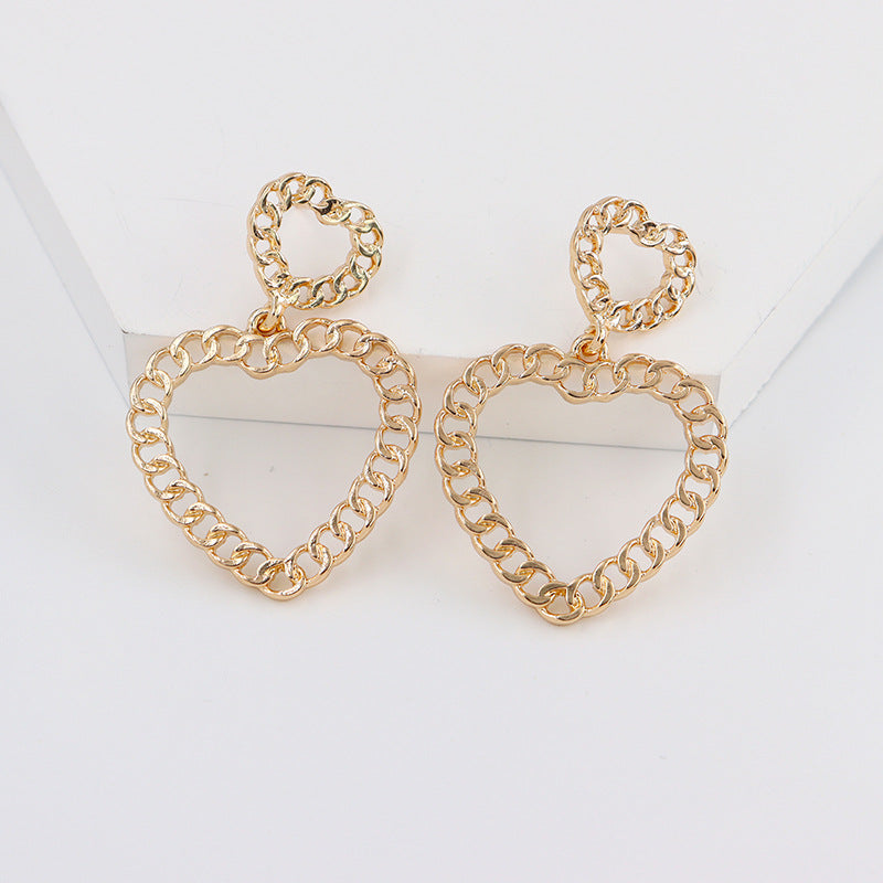 Hollow Geometric Alloy Earrings with Peach Heart Design - Vienna Verve