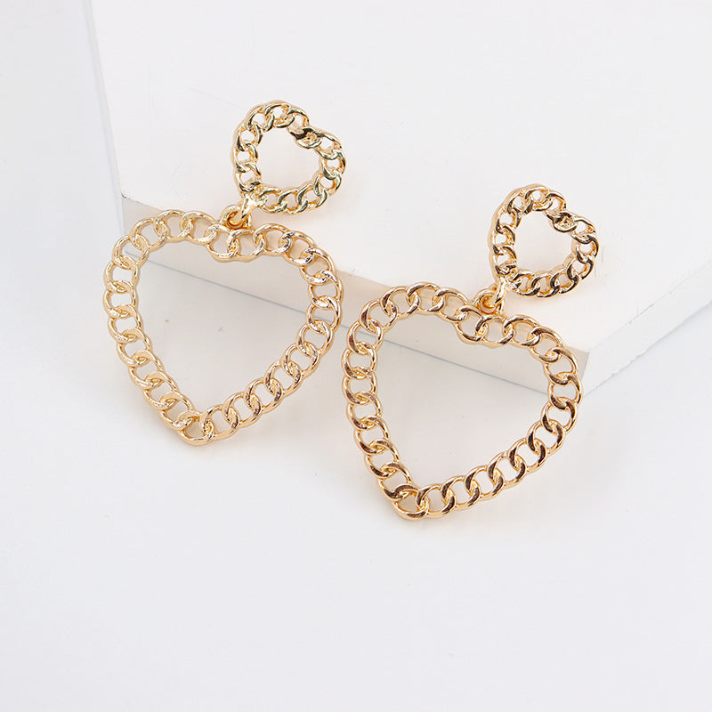 Hollow Geometric Alloy Earrings with Peach Heart Design - Vienna Verve