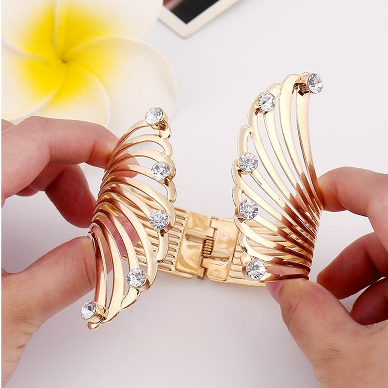 Regal Rhinestone Wing and Crown Punk Bracelet