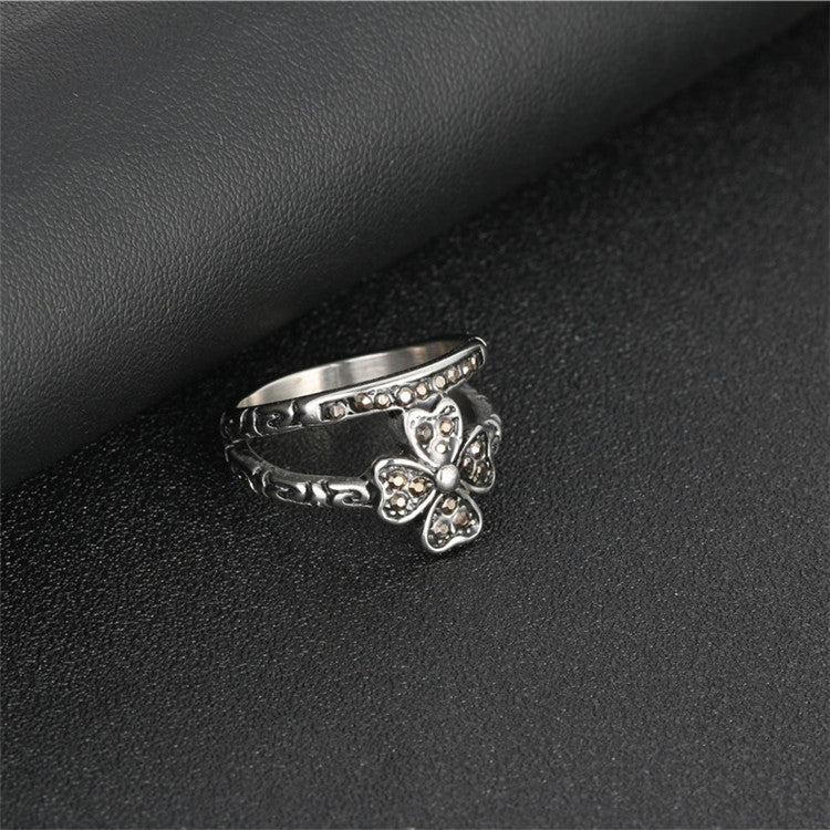 Punk-Inspired Four-Leaf Clover Titanium Steel Ring with Black Zircon Accents for Men and Women