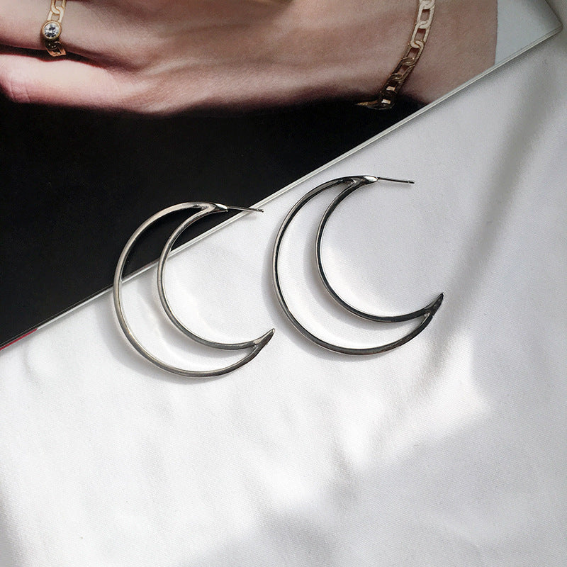 Shimmering Night Sky Crescent Earrings with Geometric Touch