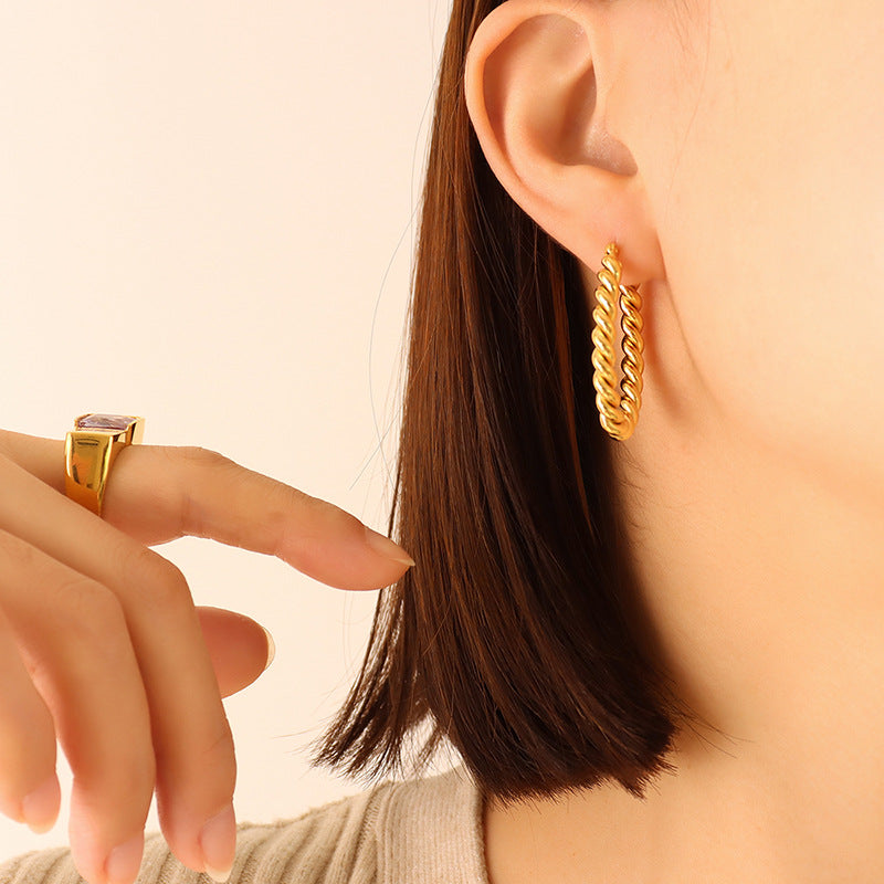 Golden Twist U-Shaped Earrings with Geometric Design