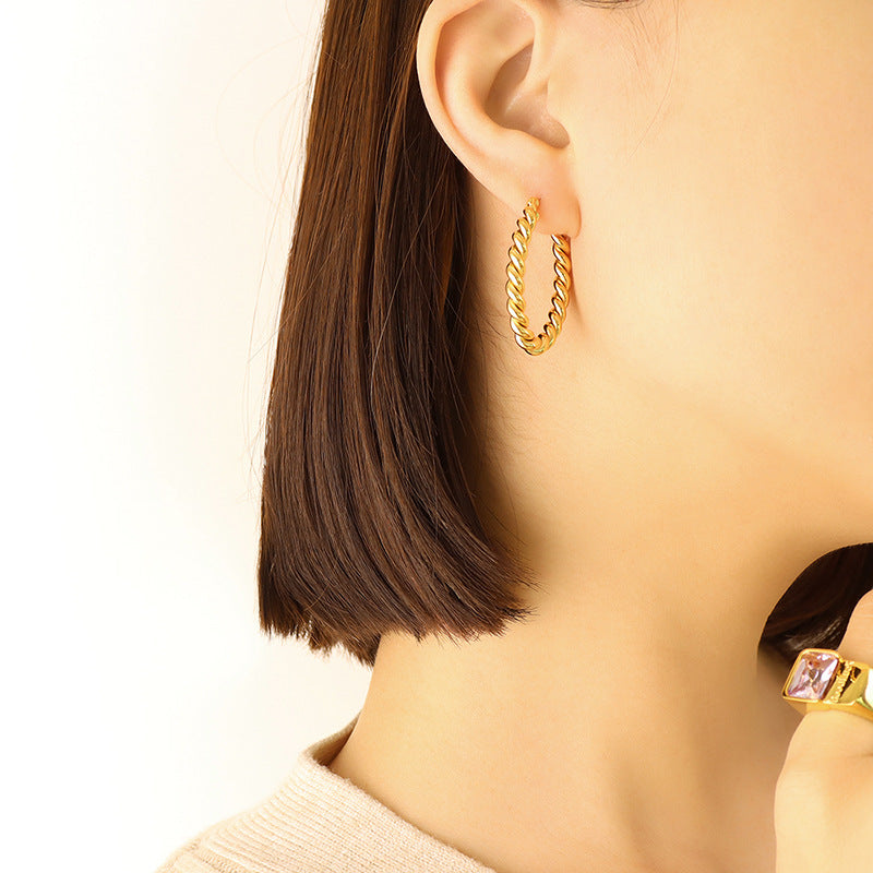 Golden Twist U-Shaped Earrings with Geometric Design