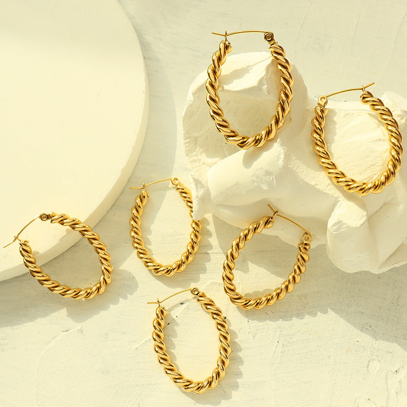 Golden Twist U-Shaped Earrings with Geometric Design