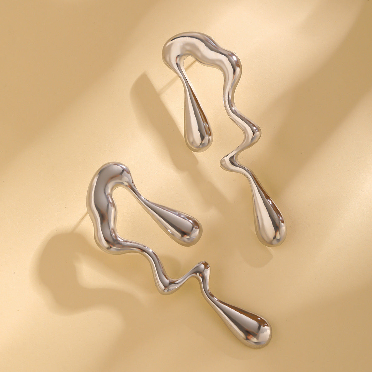 Geometric Water Droplet Earrings in Liquid Metal Style for a Trendy Look