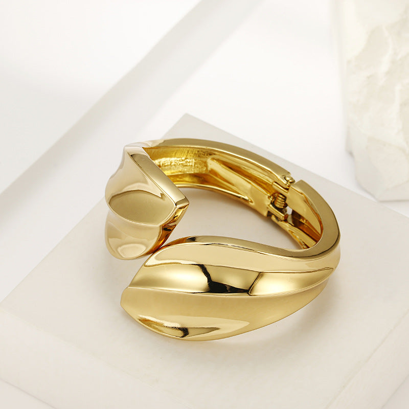 Glossy Gold Leaf Bracelet with Asymmetric Design