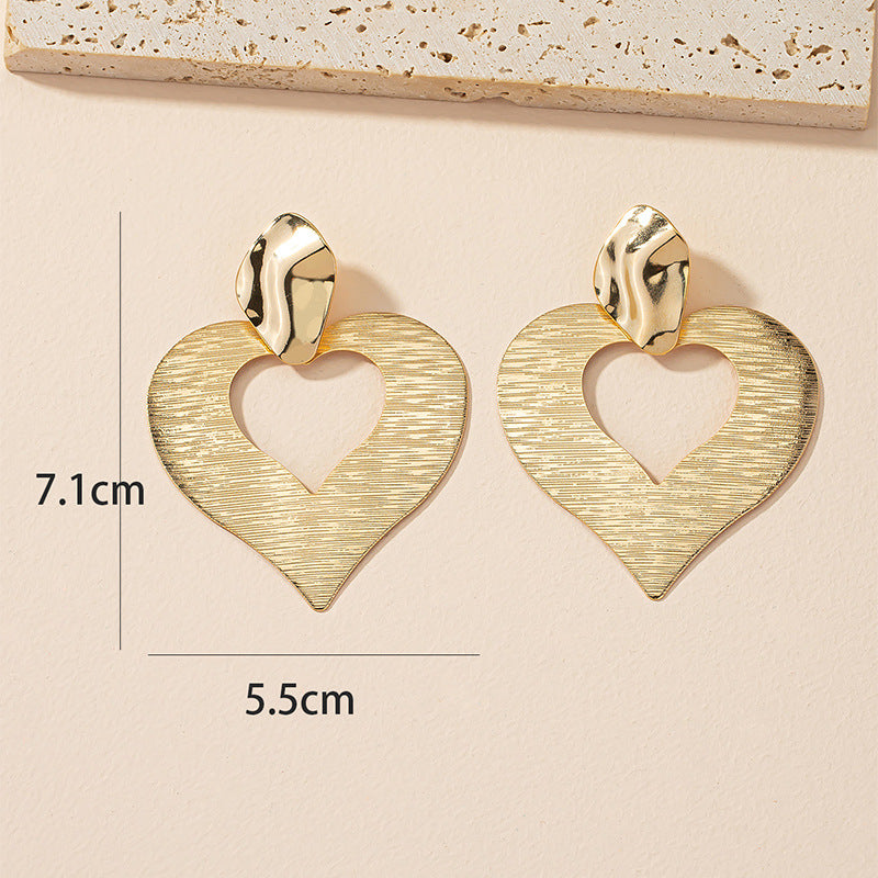 Peach Heart Hollow Stud Earrings with a Unique Design for Street Style Photographers