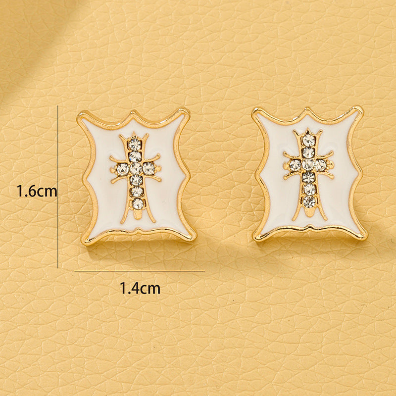 Cross Embossed Stud Earrings with a Modern Twist