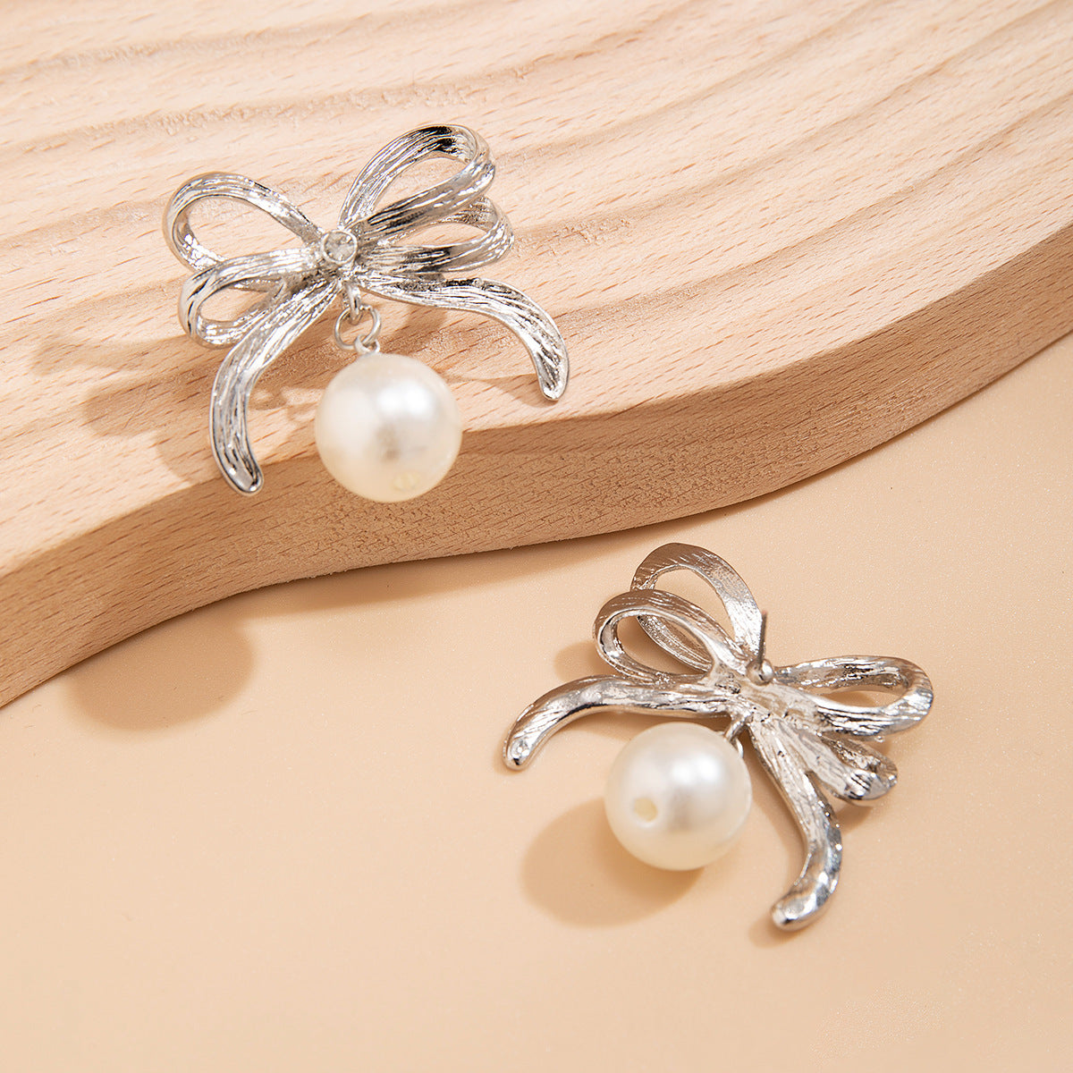 Bow Pearl Earrings with Sterling Silver Needles and Niche Metal Knot Design, Vienna Verve Collection