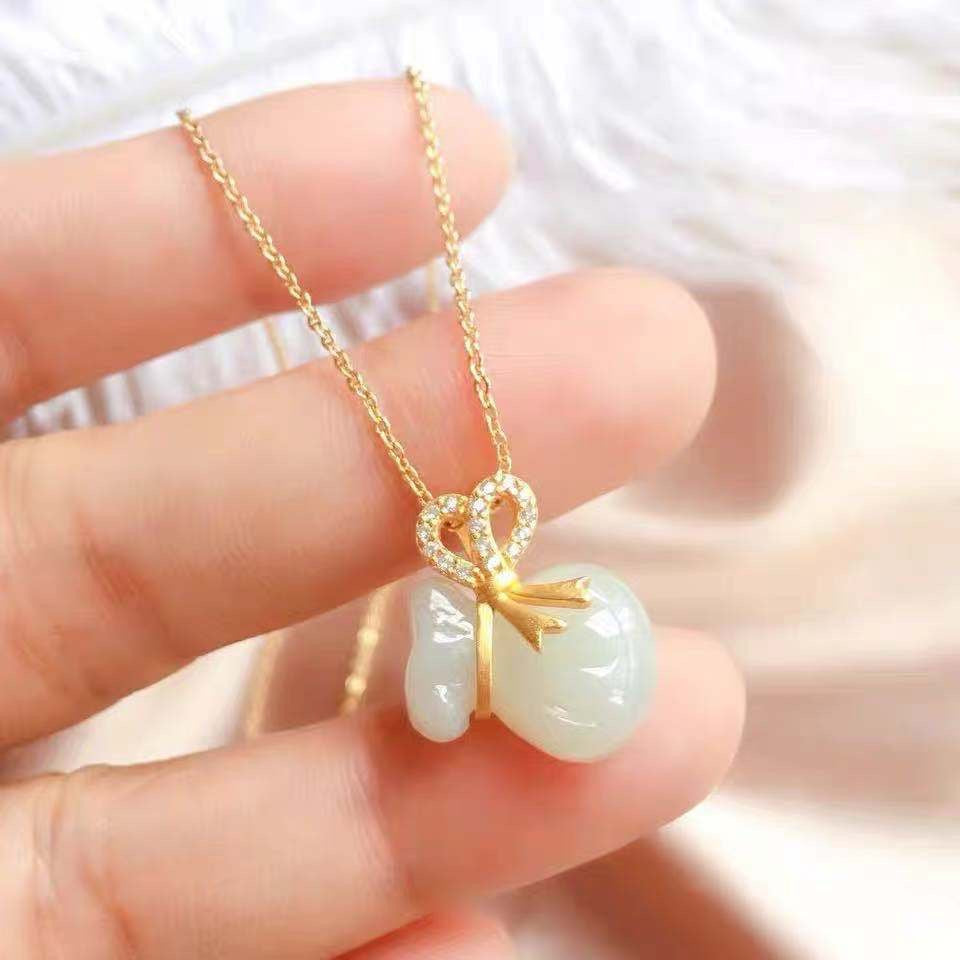 White Jade Lucky Money Bag Pendant Necklace with Zircon and Gold Accents