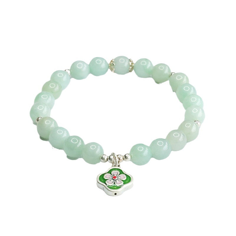 Jade Bracelet with Sterling Silver Four Leaf Flower Detail