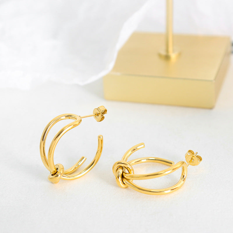 Golden Titanium Steel Rope Knot Earrings with a Twist of Elegance