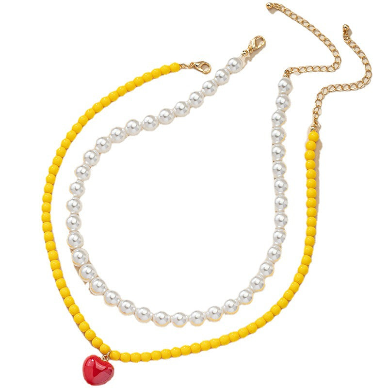 Lighthearted Pearl and Acrylic Love Necklace - Vienna Verve Collection