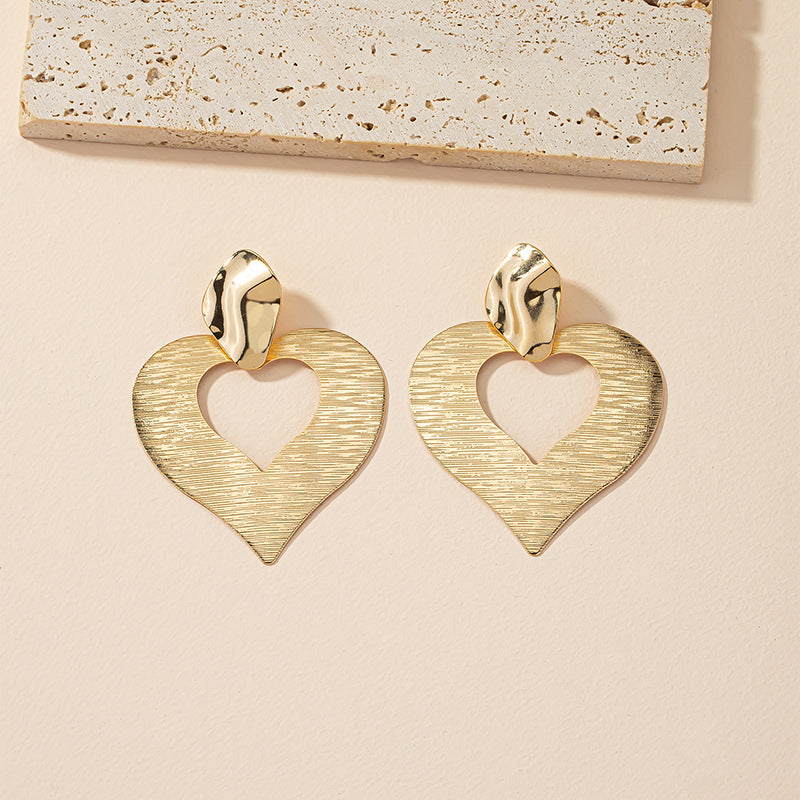 Peach Heart Hollow Stud Earrings with a Unique Design for Street Style Photographers