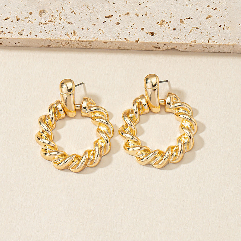 Golden Circle Twist Earrings with Stylish Woven Design