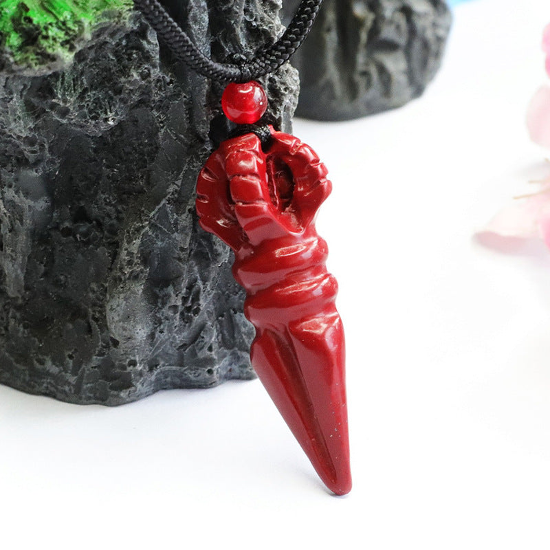 Pendant with Cinnabar Stone and Vajra Pestle Detail.