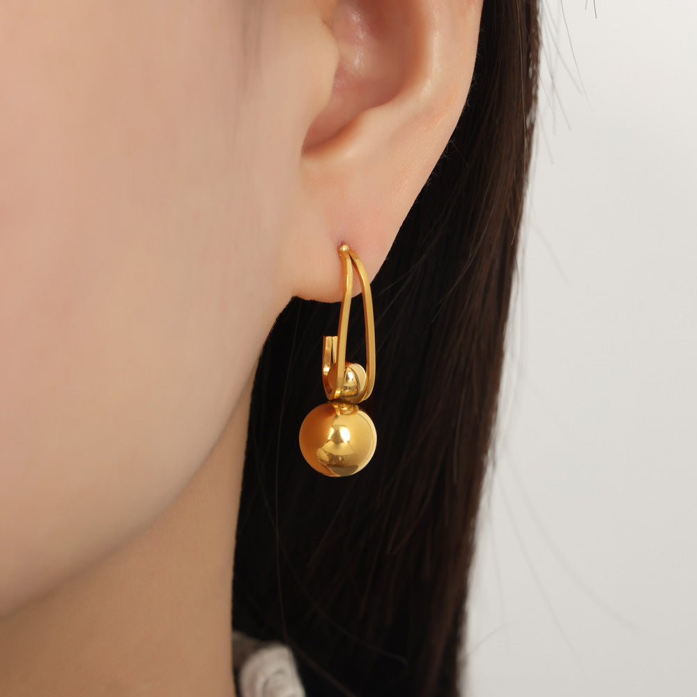 Golden Aura Titanium Earrings - Unique Design with Irregular Bead Pendant