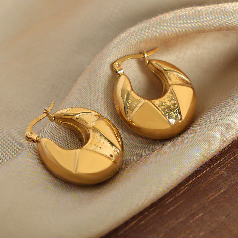 Golden Geometric High-Fashion Earrings with Unique Design