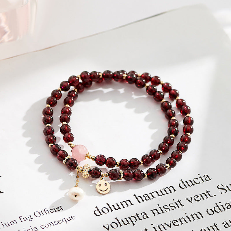 Smiling Face Pink Crystal and Pearl Bracelet with Garnet Double Ring Detail