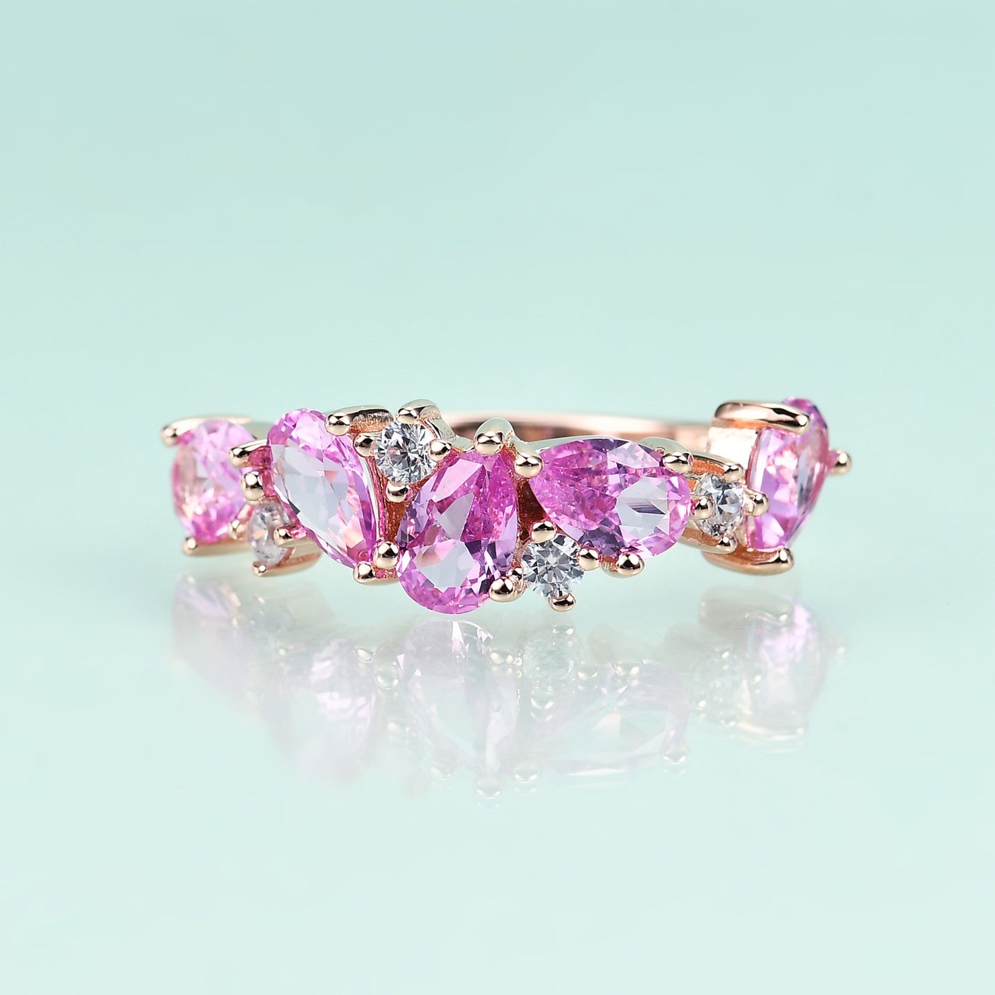 Row of Pear Shape Barbie Pink Corundum and Zircon Silver Ring