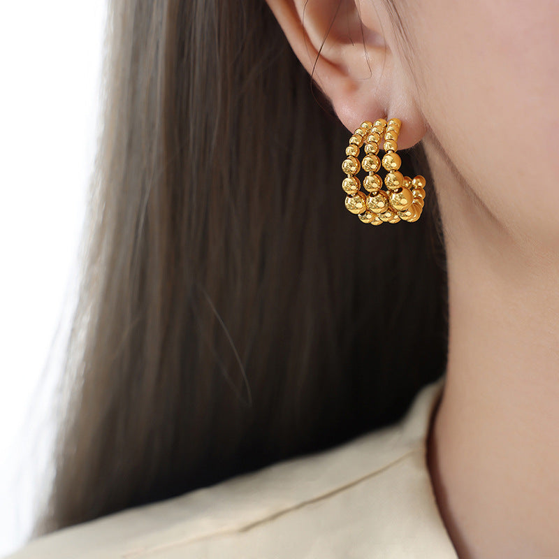 Golden Plated Steel Ball Earrings with Unique Design