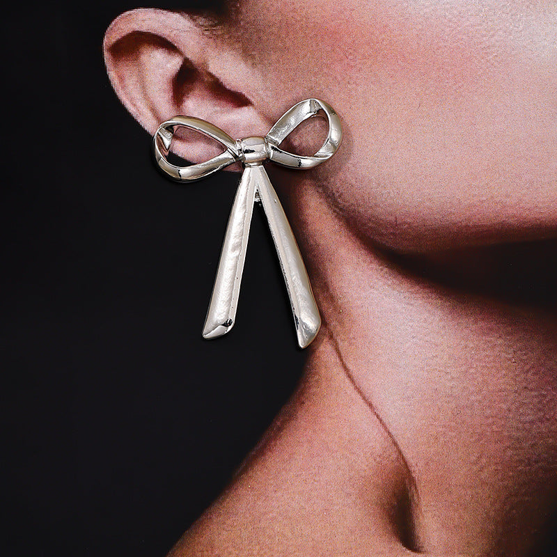 Exaggerated Metal Ribbon Knot Earrings with a Touch of Vienna Glam