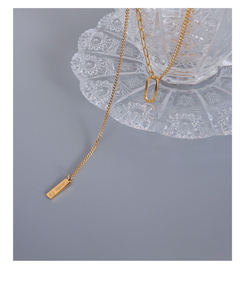 French Instagram Style Gold Tassel Necklace with Elliptical Geometry Pendant