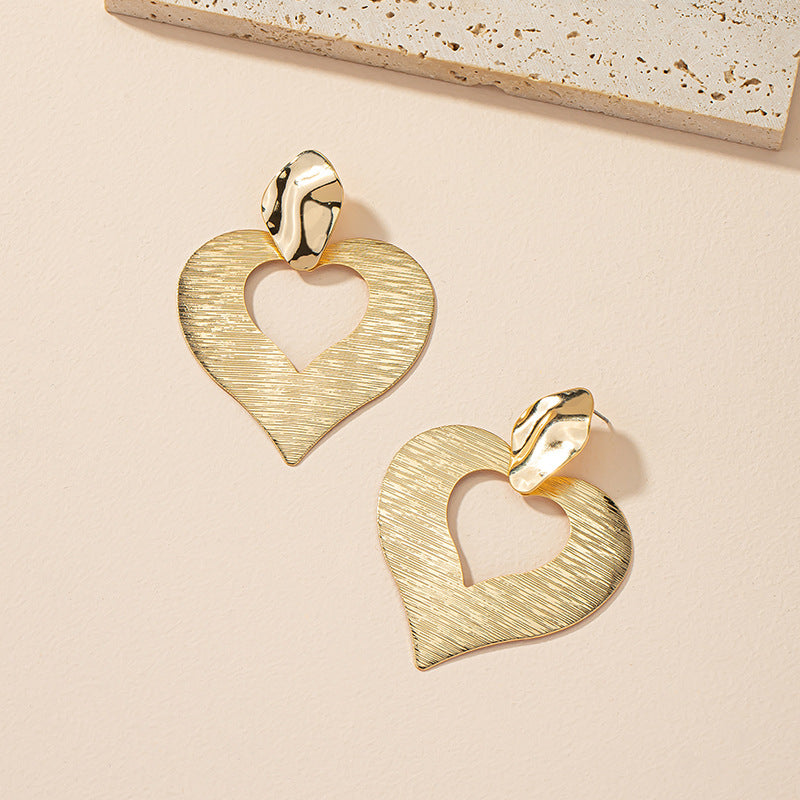 Peach Heart Hollow Stud Earrings with a Unique Design for Street Style Photographers