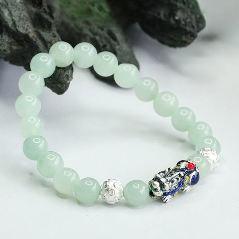 A Jade Bracelet with Sterling Silver and Copper Coin