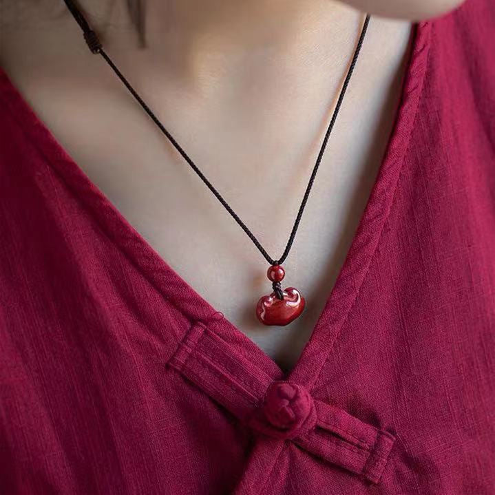 Elegant Cinnabar Fortune Pendant with Purple and Gold Sand Accents