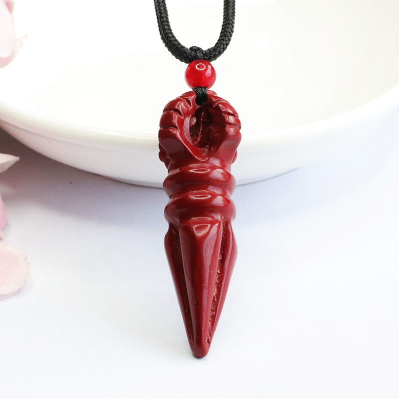 Pendant with Cinnabar Stone and Vajra Pestle Detail.