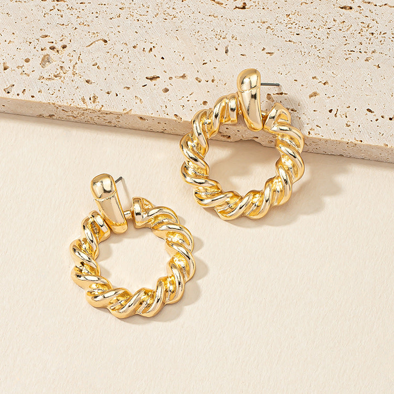 Golden Circle Twist Earrings with Stylish Woven Design