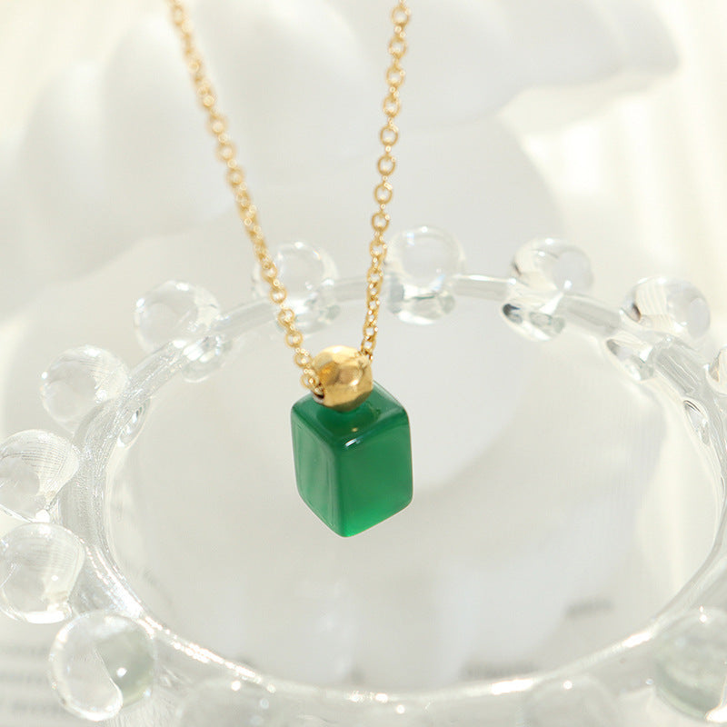 Emerald Glass Pendant Necklace with a Vintage Twist in Gold-Plated Titanium Steel