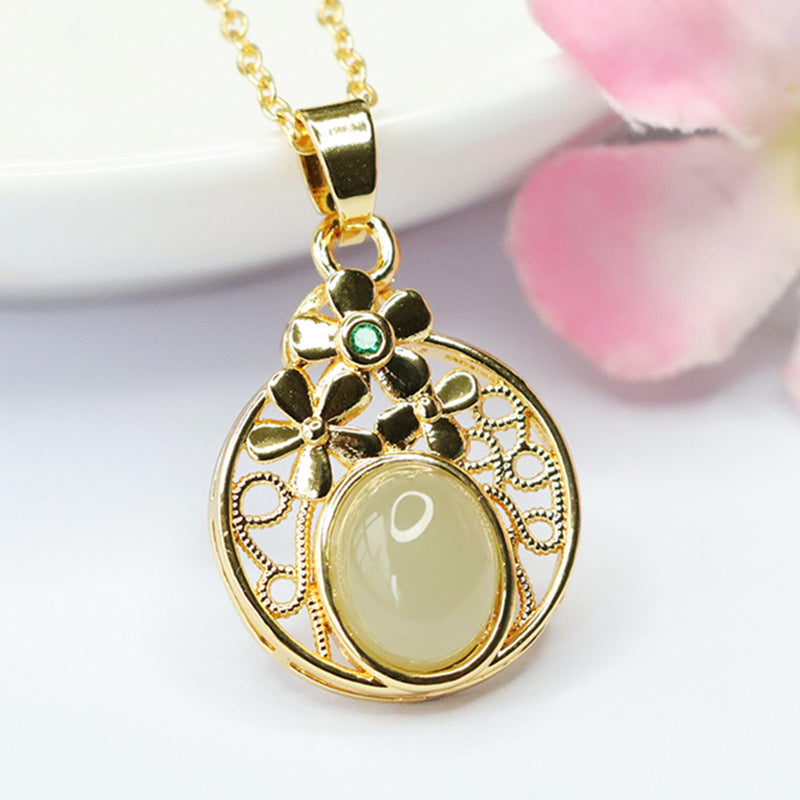 Elegant Hetian Jade Pendant with Sterling Silver Hollow Flower Design