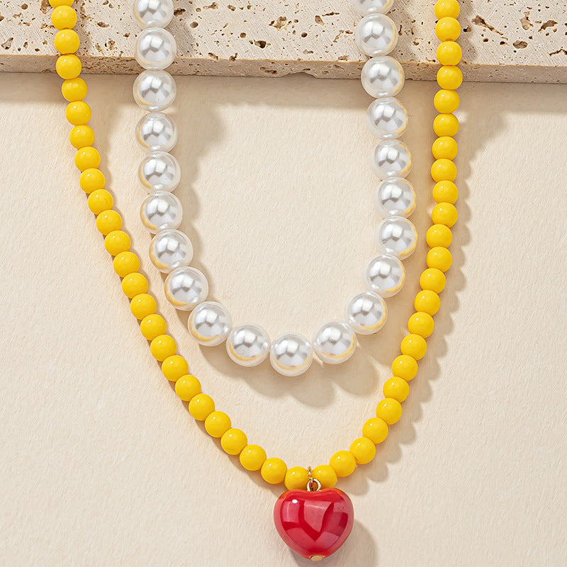 Lighthearted Pearl and Acrylic Love Necklace - Vienna Verve Collection