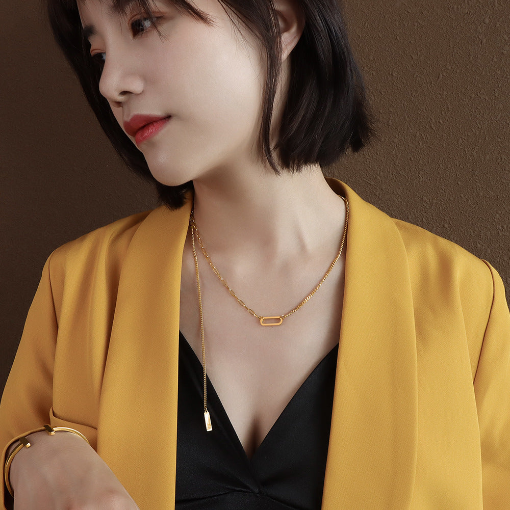 French Instagram Style Gold Tassel Necklace with Elliptical Geometry Pendant