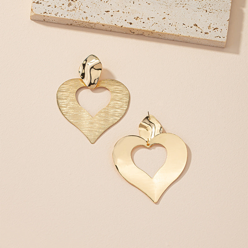 Peach Heart Hollow Stud Earrings with a Unique Design for Street Style Photographers