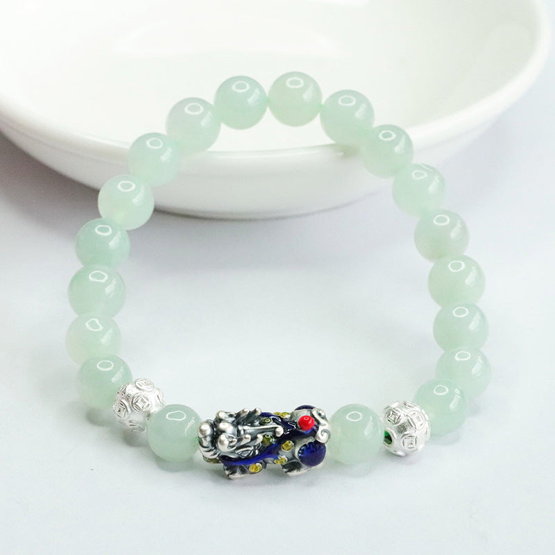 A Jade Bracelet with Sterling Silver and Copper Coin