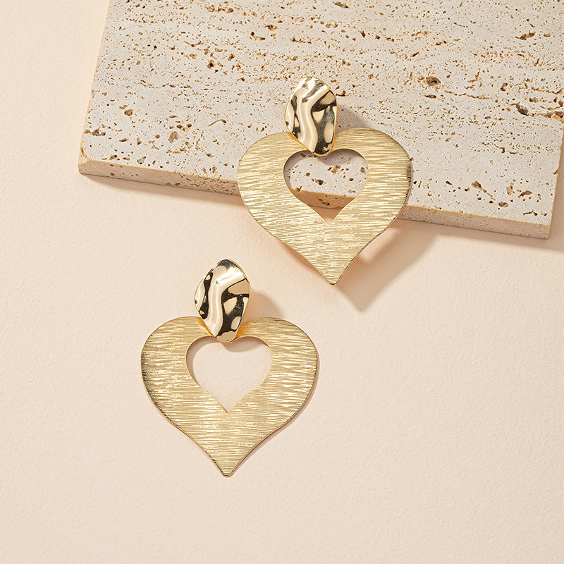 Peach Heart Hollow Stud Earrings with a Unique Design for Street Style Photographers