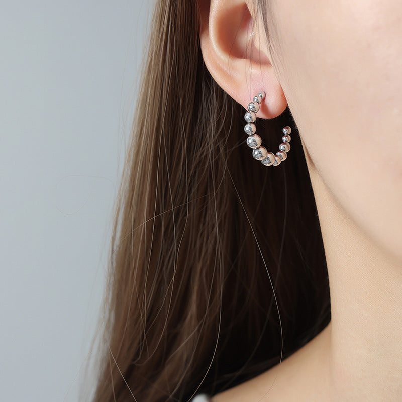 Golden Retro Steel Ball U-Shaped Earrings with a Touch of Luxury