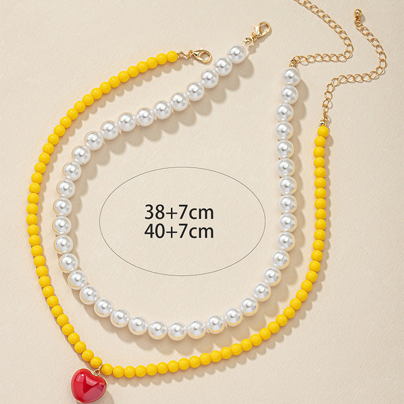 Lighthearted Pearl and Acrylic Love Necklace - Vienna Verve Collection