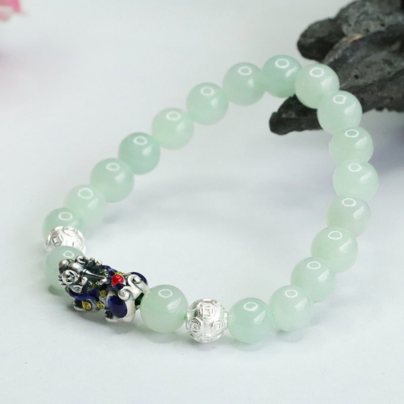 A Jade Bracelet with Sterling Silver and Copper Coin