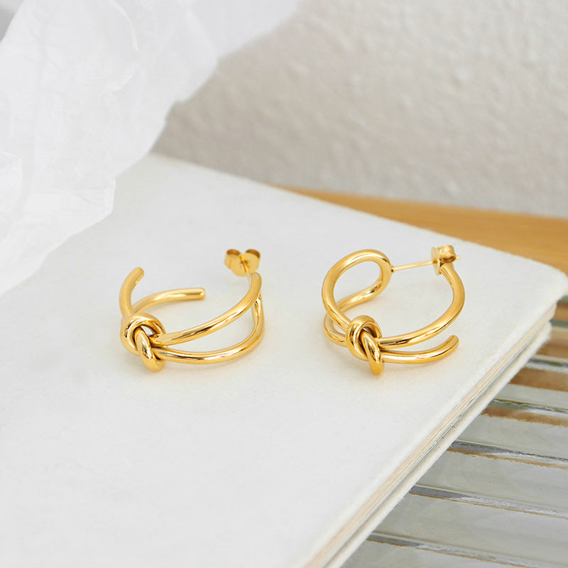 Golden Titanium Steel Rope Knot Earrings with a Twist of Elegance