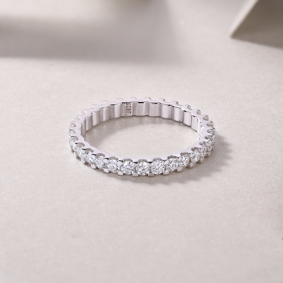 0.9 Carat Round Moissanite Eternity Ring in S925 Silver with Platinum Plating - Four Prong Design